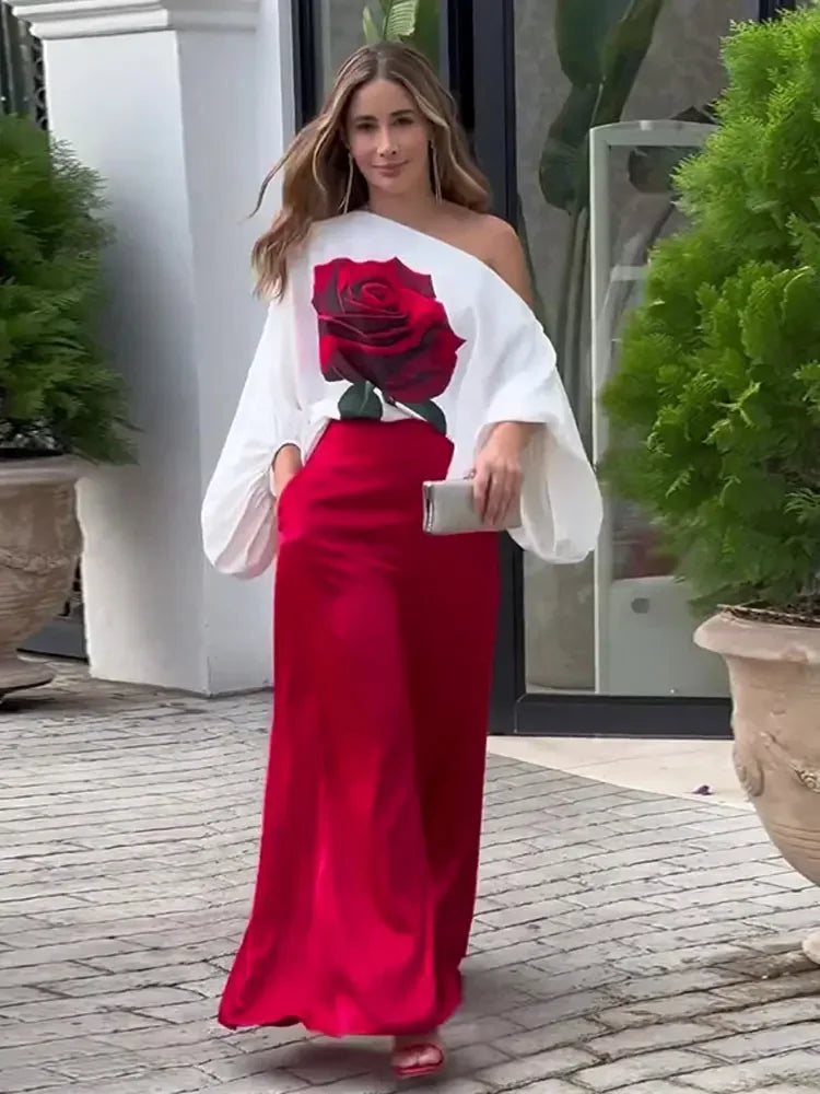 Zarelle | Roze outfit voor dames met bloemenprint – Blouse met schuine halslijn en broek met wijde pijpen
